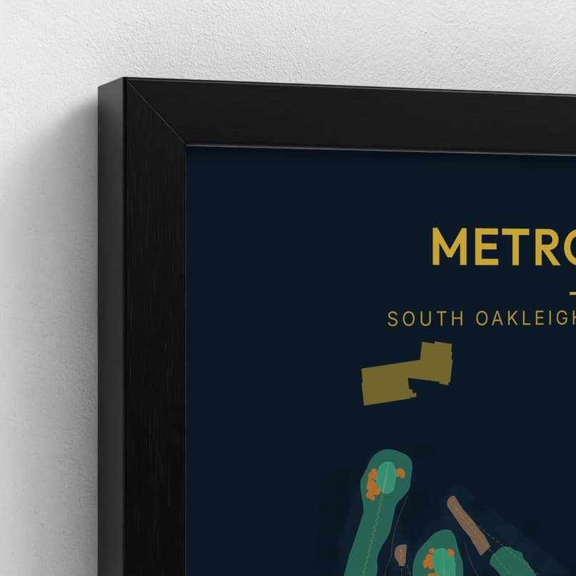 The corner of a black box frame over a dark course print